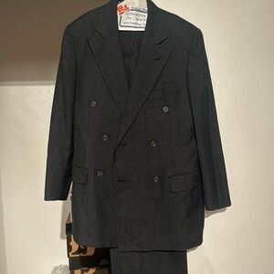 This is a charcoal grey and black men suit.